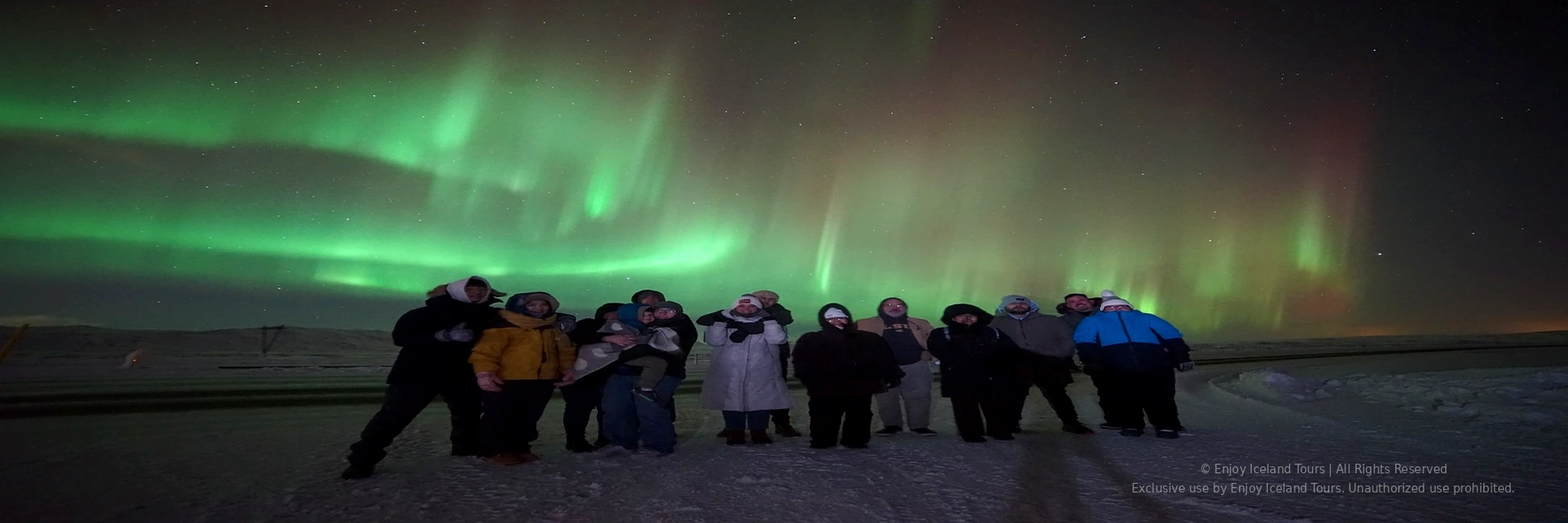Family enjoying a private Northern Lights tour in Iceland
